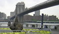 A large drill bit emerging from the Fulton Ferry Landing, Brooklyn.